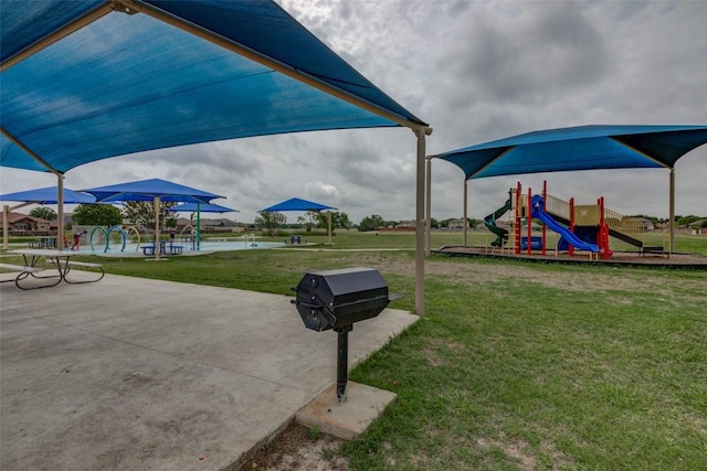 700 Indian Blanket St, Lockhart, TX 78644 - community playground featuring a lawn
