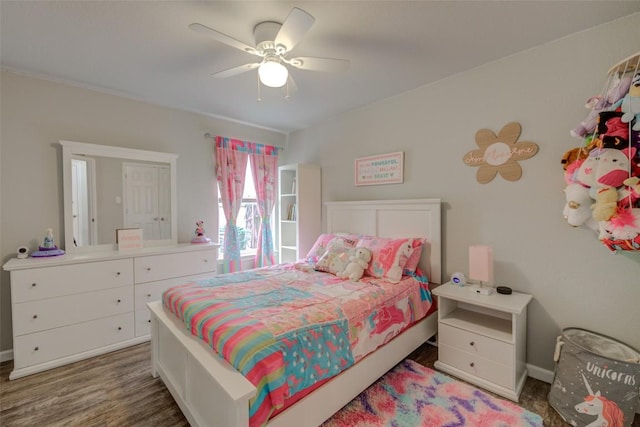 700 Indian Blanket St, Lockhart, TX 78644 - bedroom with wood finished floors and ceiling fan