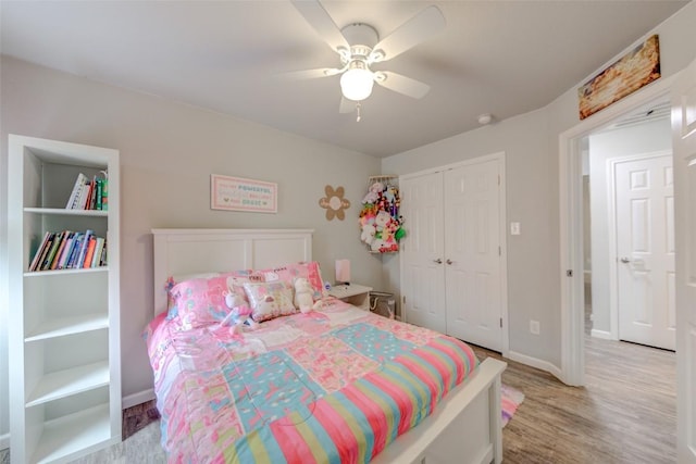 700 Indian Blanket St, Lockhart, TX 78644 - bedroom featuring a closet, light wood-style floors, and a ceiling fan