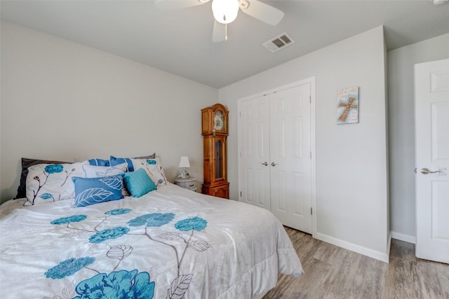 700 Indian Blanket St, Lockhart, TX 78644 - bedroom featuring wood finished floors, a closet, and a ceiling fan