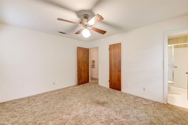 2502 Greenlawn Pkwy, Austin, TX 78757 - unfurnished bedroom featuring carpet flooring, ensuite bath, and a ceiling fan