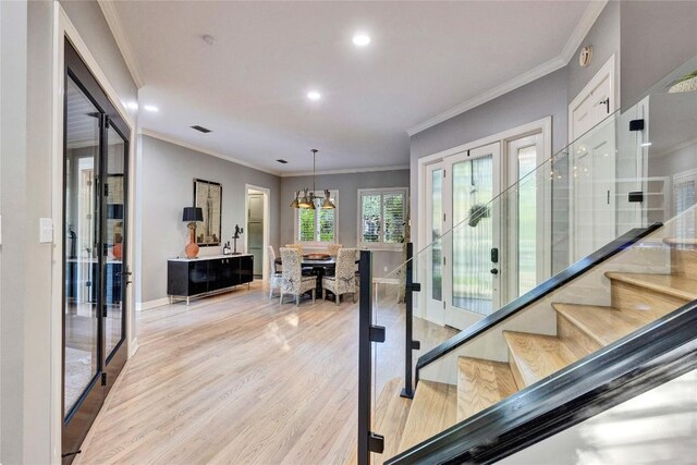 4812 Mantle Dr, Austin, TX 78746 - stairs featuring wood finished floors, ornamental molding, recessed lighting, and french doors