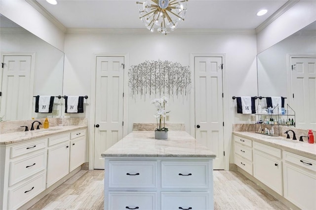 4812 Mantle Dr, Austin, TX 78746 - full bath featuring a chandelier, two vanities, wood finished floors, ornamental molding, and recessed lighting