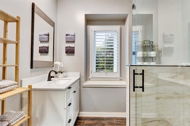 4812 Mantle Dr, Austin, TX 78746 - bathroom with vanity, a shower stall, baseboards, and wood finished floors