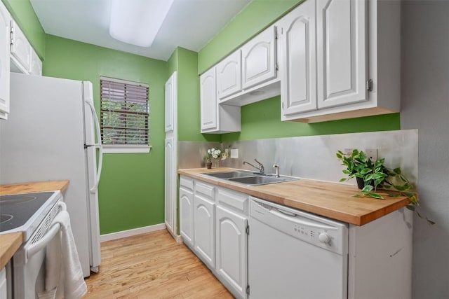 203 E 31st St Unit 304, Austin, TX 78705 - kitchen with white appliances, light wood finished floors, white cabinets, and wooden counters