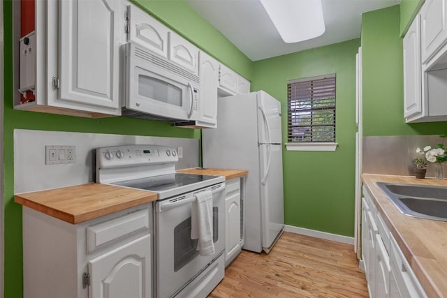 203 E 31st St Unit 304, Austin, TX 78705 - kitchen featuring white appliances, wooden counters, white cabinetry, and light wood-style floors
