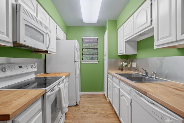 203 E 31st St Unit 304, Austin, TX 78705 - kitchen featuring white appliances, wood counters, light wood finished floors, and white cabinets