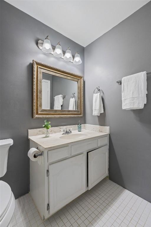 203 E 31st St Unit 304, Austin, TX 78705 - bathroom featuring toilet, vanity, and tile patterned floors
