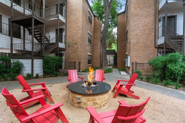 203 E 31st St Unit 304, Austin, TX 78705 - view of community with a fire pit and stairs
