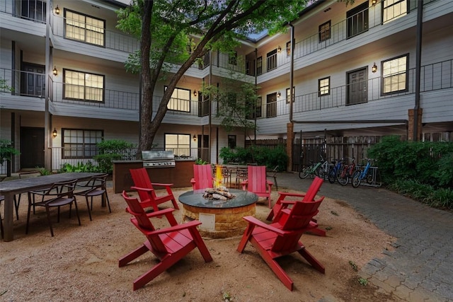 203 E 31st St Unit 304, Austin, TX 78705 - view of patio / terrace with an outdoor fire pit and a grill