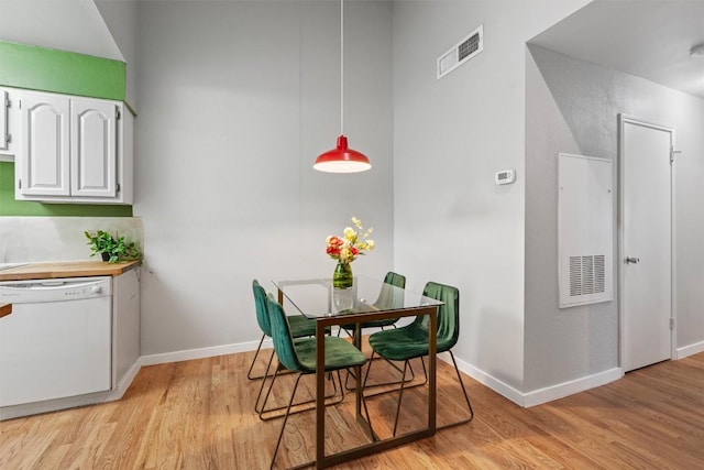 203 E 31st St Unit 304, Austin, TX 78705 - dining area with light wood-style flooring and baseboards