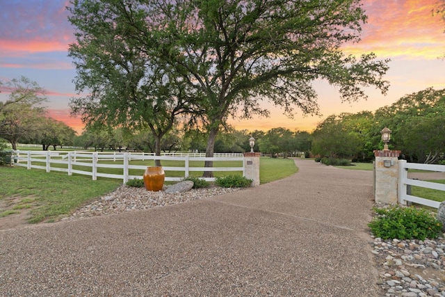 412 Haney Trce, Horseshoe Bay, TX 78657 - view of asphalt driveway featuring street lights