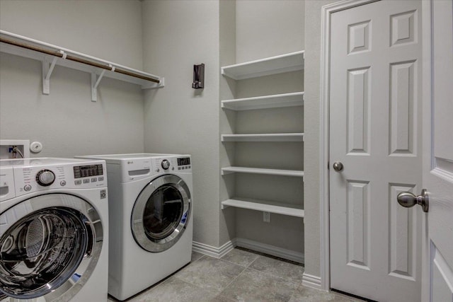 216 Allegrini St, Leander, TX 78641 - washroom featuring separate washer and dryer and baseboards