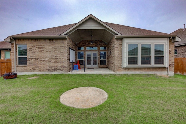 216 Allegrini St, Leander, TX 78641 - rear view of house with ceiling fan, french doors, a fire pit, and brick siding