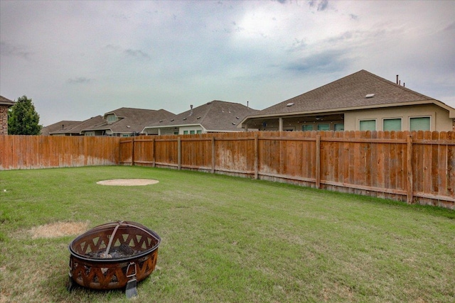 216 Allegrini St, Leander, TX 78641 - fenced backyard with a fire pit