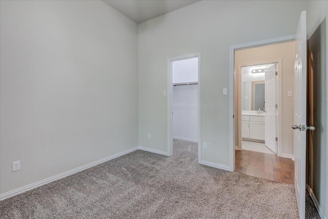 216 Allegrini St, Leander, TX 78641 - unfurnished bedroom featuring carpet floors and a walk in closet