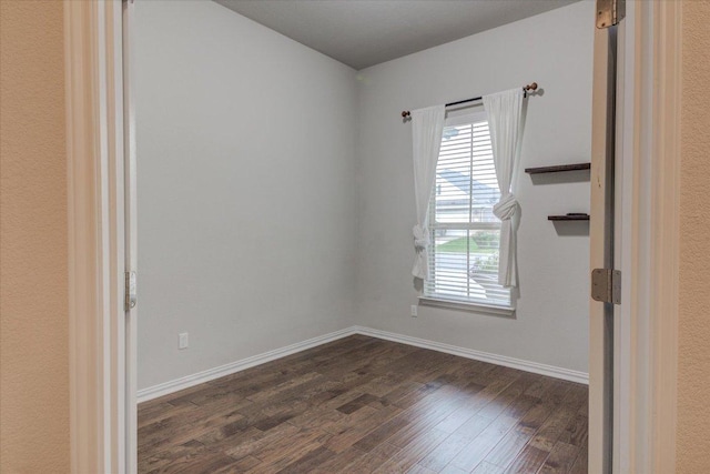 216 Allegrini St, Leander, TX 78641 - empty room with dark wood-style floors and baseboards