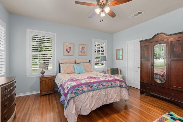 1922 W Lake Dr, Taylor, TX 76574 - bedroom with wood finished floors and ceiling fan
