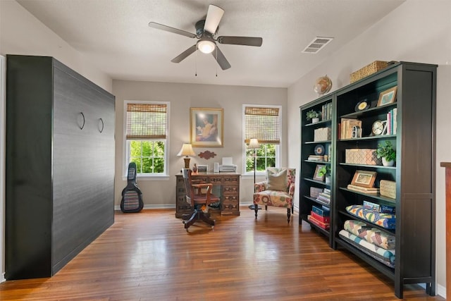 1922 W Lake Dr, Taylor, TX 76574 - office area with plenty of natural light, wood finished floors, and a ceiling fan