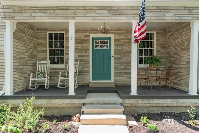 1922 W Lake Dr, Taylor, TX 76574 - doorway to property featuring a porch and stone siding