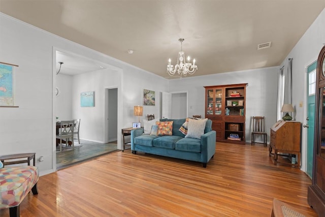 1922 W Lake Dr, Taylor, TX 76574 - living area featuring light wood-style floors and a chandelier