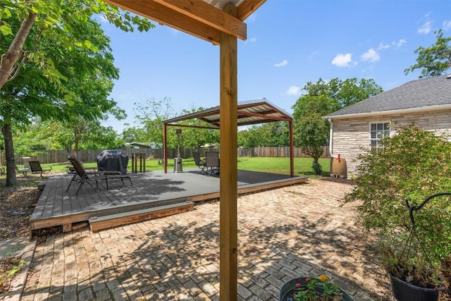 1922 W Lake Dr, Taylor, TX 76574 - fenced backyard with a gazebo, a wooden deck, a grill, and a patio