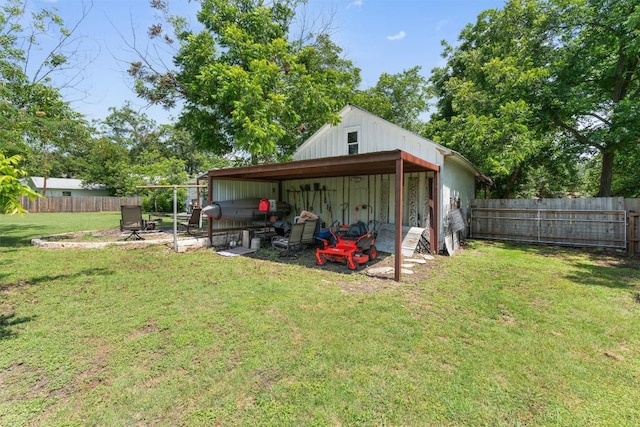 1922 W Lake Dr, Taylor, TX 76574 - fenced backyard with a carport and a pole building