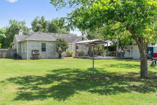 1922 W Lake Dr, Taylor, TX 76574 - rear view of property with stone siding and a deck