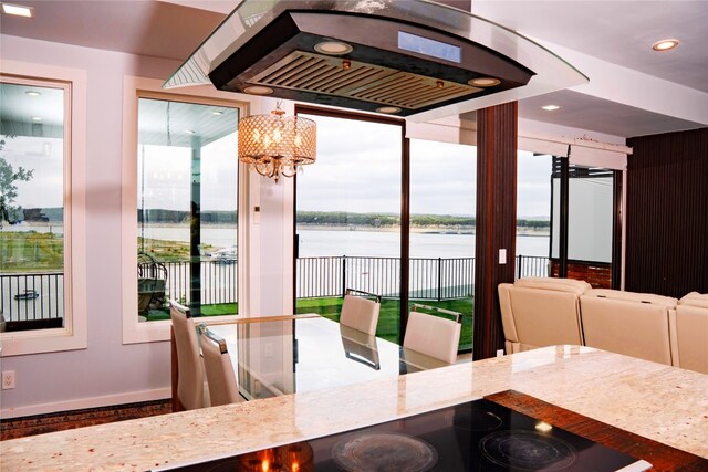 1800 Buffalo Gap Rd, Austin, TX 78734 - dining area with a water view, a chandelier, and recessed lighting