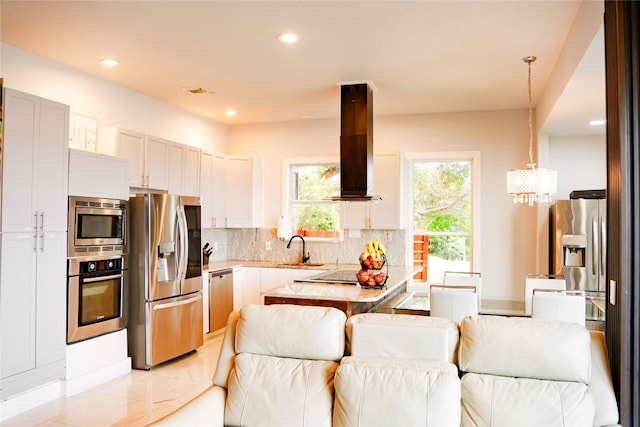 1800 Buffalo Gap Rd, Austin, TX 78734 - kitchen with appliances with stainless steel finishes, open floor plan, wall chimney range hood, backsplash, and recessed lighting