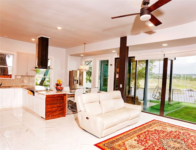 1800 Buffalo Gap Rd, Austin, TX 78734 - living area with ceiling fan, light marble finish floors, recessed lighting, and a chandelier