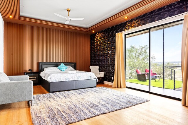 1800 Buffalo Gap Rd, Austin, TX 78734 - bedroom featuring access to outside, multiple windows, and wood finished floors