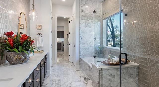 1316 Novara Trl, Leander, TX 78641 - full bath with marble tiled flooring, vanity, plenty of natural light, and a garden tub