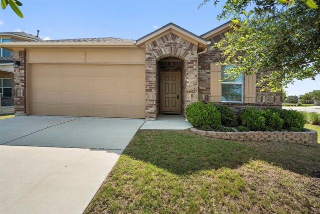 1407 Brashear Ct, Cedar Park, TX 78613 - view of front of house with brick siding, a garage, and driveway