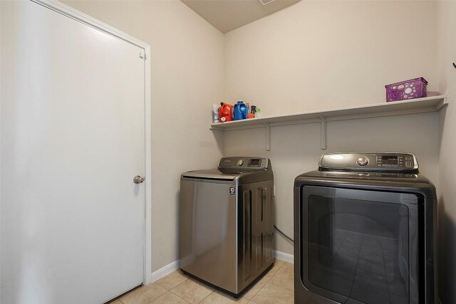 1407 Brashear Ct, Cedar Park, TX 78613 - washroom with washing machine and clothes dryer and light tile patterned floors