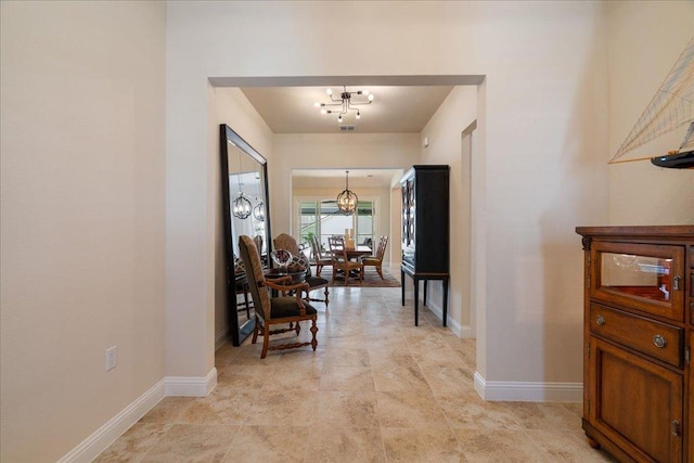 309 Singing Sumac Way, San Marcos, TX 78666 - hall featuring a chandelier and baseboards