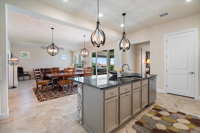309 Singing Sumac Way, San Marcos, TX 78666 - kitchen featuring a sink, a chandelier, gray cabinets, dishwasher, and dark stone countertops