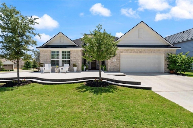 309 Singing Sumac Way, San Marcos, TX 78666 - traditional-style home with driveway, a garage, brick siding, and a front lawn