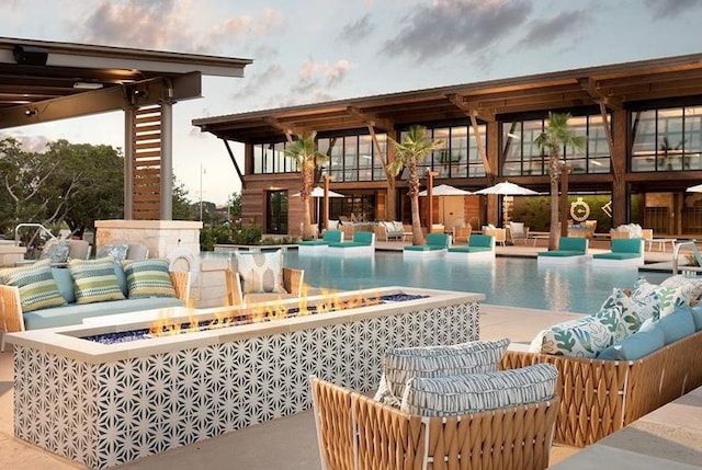 309 Singing Sumac Way, San Marcos, TX 78666 - community pool featuring an outdoor living space with a fire pit