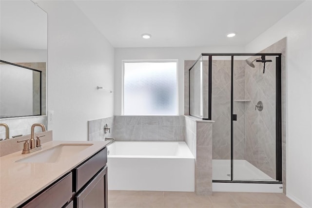 13308 Nancy Reagan St, Manor, TX 78653 - bathroom with vanity, a garden tub, tile patterned flooring, a shower stall, and recessed lighting