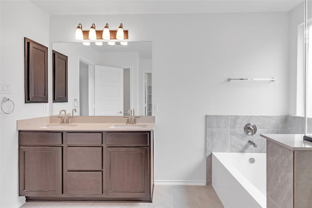 13308 Nancy Reagan St, Manor, TX 78653 - bathroom with a garden tub, double vanity, and tile patterned floors