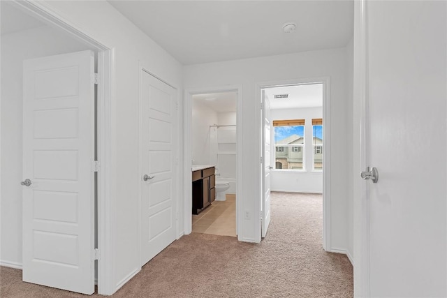 13308 Nancy Reagan St, Manor, TX 78653 - hall featuring light carpet and baseboards