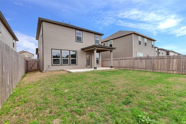 13308 Nancy Reagan St, Manor, TX 78653 - rear view of house with a patio and a fenced backyard