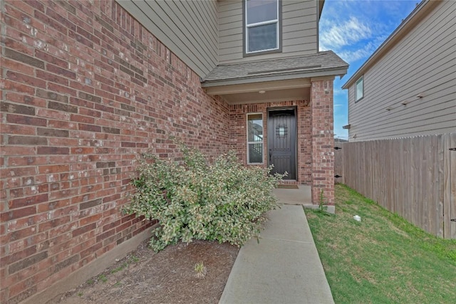 13308 Nancy Reagan St, Manor, TX 78653 - doorway to property with brick siding and roof with shingles