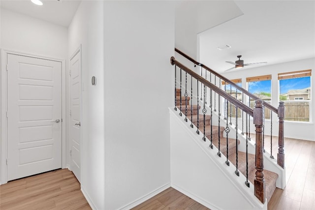 13308 Nancy Reagan St, Manor, TX 78653 - stairs with wood finished floors, ceiling fan, and recessed lighting