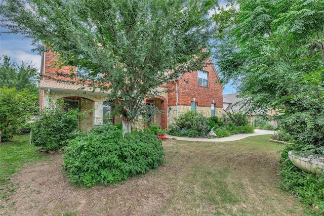 222 Vailco Ln, Austin, TX 78738 - view of front of house with stone siding and a front lawn