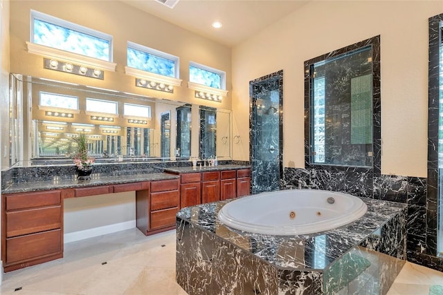 222 Vailco Ln, Austin, TX 78738 - bathroom featuring a whirlpool tub, vanity, and recessed lighting