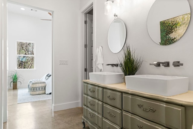 4622 Marlo Dr, Austin, TX 78723 - bathroom featuring double vanity and concrete floors