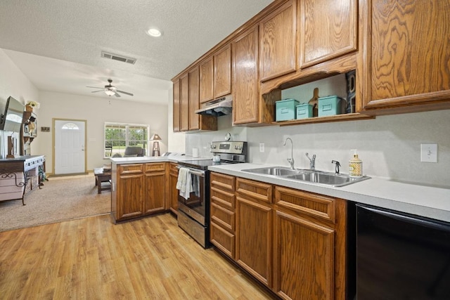 1201 County Road 229, Florence, TX 76527 - kitchen featuring electric stove, a ceiling fan, brown cabinets, light wood-style flooring, and light countertops