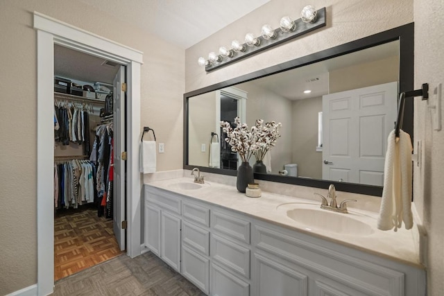 1201 County Road 229, Florence, TX 76527 - bathroom featuring double vanity and a spacious closet